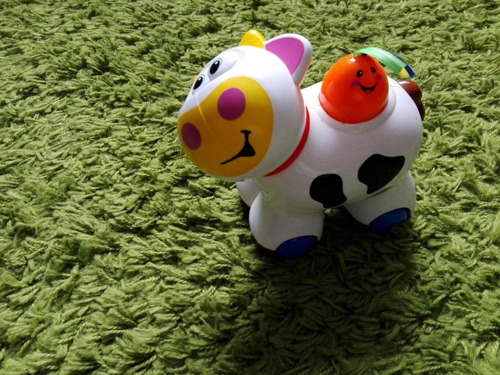 Kiddieland jeżdżąca grająca krowa do raczkowania